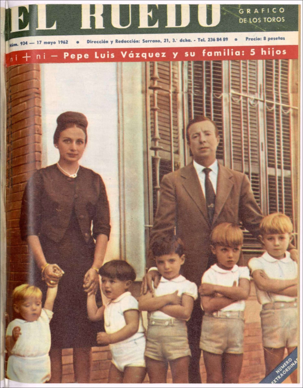A magazine cover featuring a family of four standing in front of a window, with text at the top and bottom of the cover.