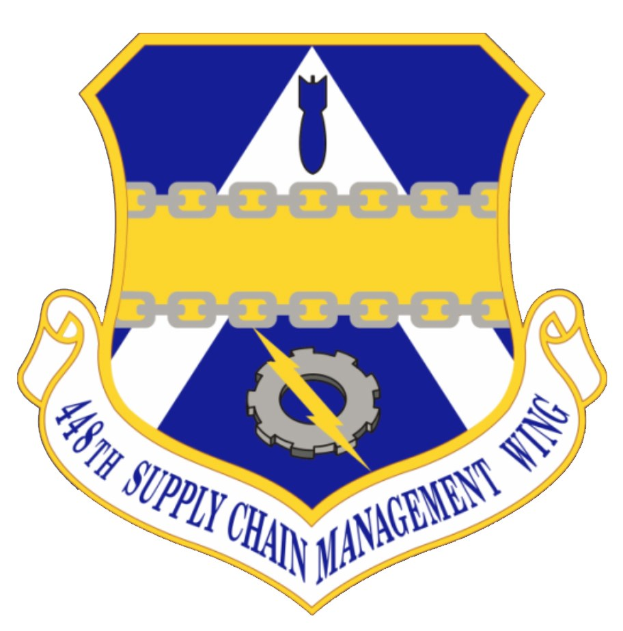 Logo des 48. Versorgungsmanagementgeschwader mit einem blauen Schild mit einem weißen Stern und einem weißen Banner mit der Aufschrift "Versorgungsmanagement" in blau, alles in einem weißen Rahmen mit der schwarzen Schrift "48. Versorgungsmanagementgeschwader".