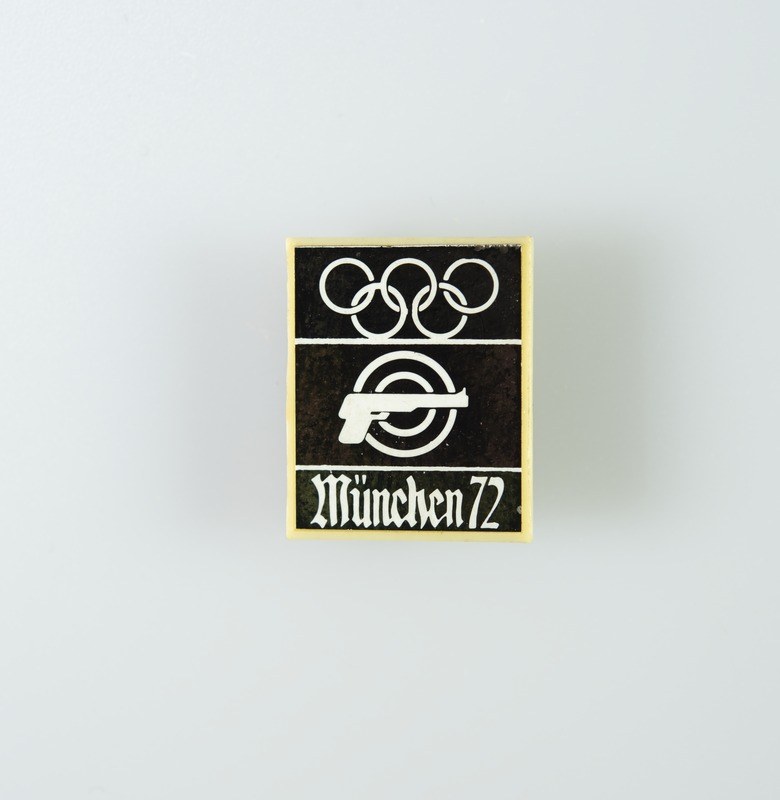 Black and white logo for München 1972 featuring a stylized figure within a circle and the text in bold black font.