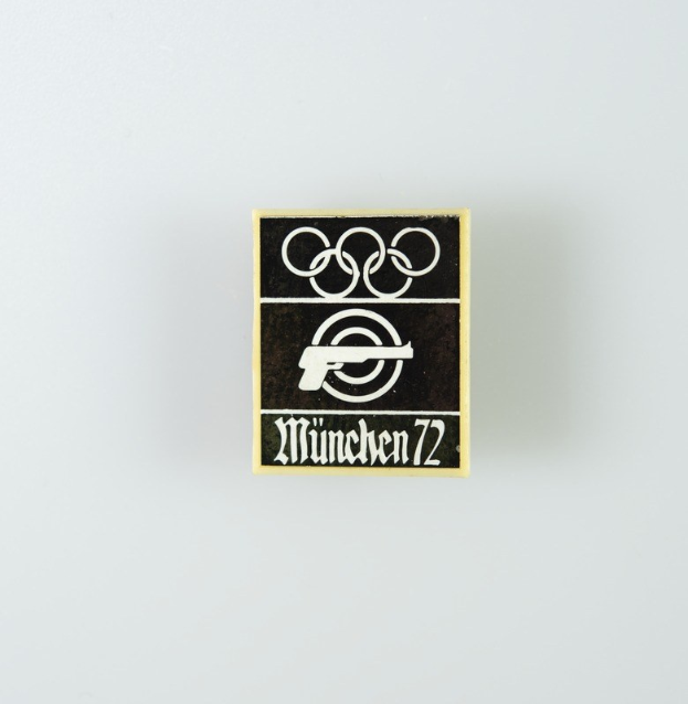 Black and white logo for München 1972 featuring a stylized figure within a circle and the text in bold black font.