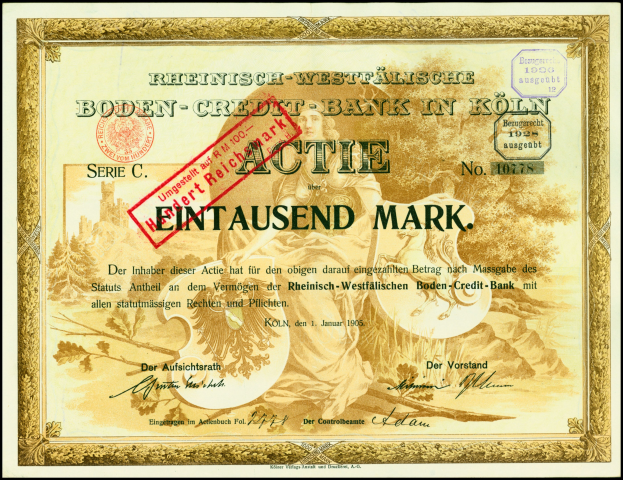 Rahmung alter deutscher Bankschein mit Porträt eines Mannes im Anzug und Krawatte mit ernstem Gesichtsausdruck, begleitet von Text und einem Stempel.