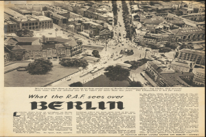Schwarze und weiße Zeitung mit einem Stadtpanorama-Foto, das Gebäude, Bäume und Fahrzeuge zeigt und von Text begleitet wird.