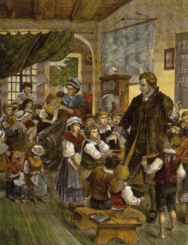 Gemälde mit dem Titel 'Die Lehrerklasse' von William Hogarth, das einen Mann zeigt, der vor einem Klassenzimmer mit Kindern steht, einige sitzen auf Bänken, andere stehen auf dem Boden, eine Tafel mit Text, ein gerahmtes Foto, ein Fenster mit einem Vorhang und eine sichtbare Decke.