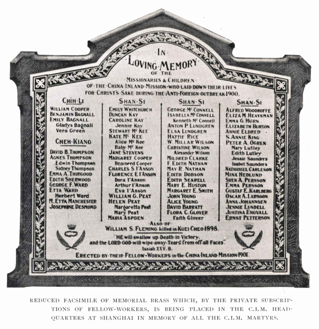 Black and white photo of a memorial plaque with the words "Loving Memory" inscribed on it.