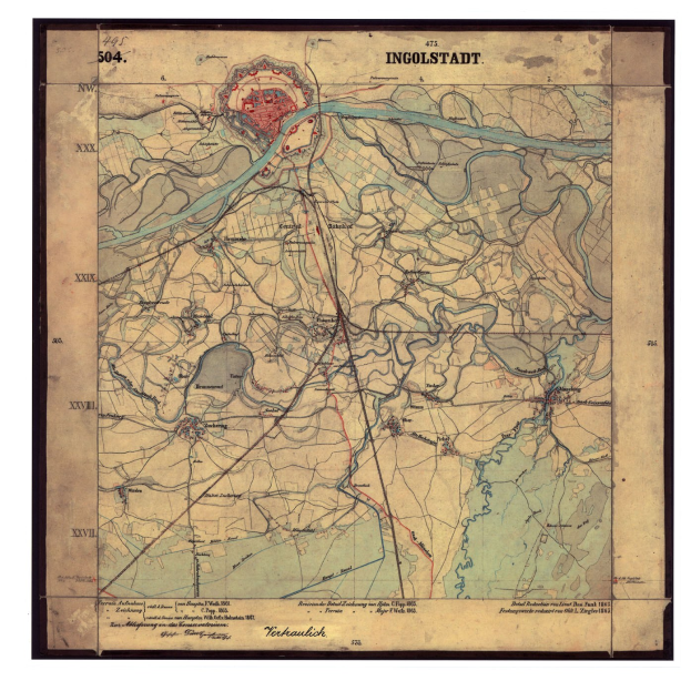 Old framed map of Ingolstadt, Germany, displaying streets, buildings, and landmarks with descriptive text.