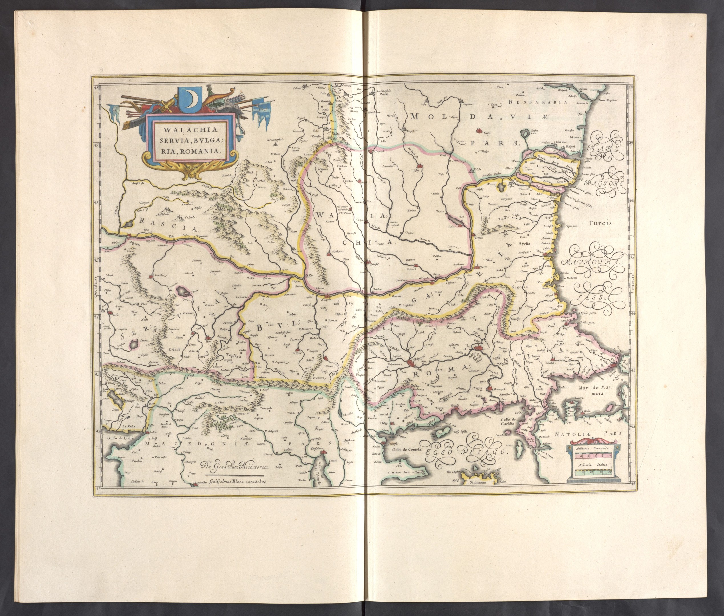 Open book displaying detailed maps of Poland and Hungary against a black background.
